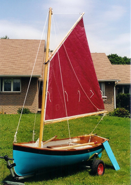 9 foot sailing dinghy with sails up